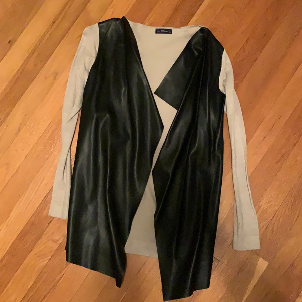 beige & black leather cardigan. sweater sleeves, leather front.